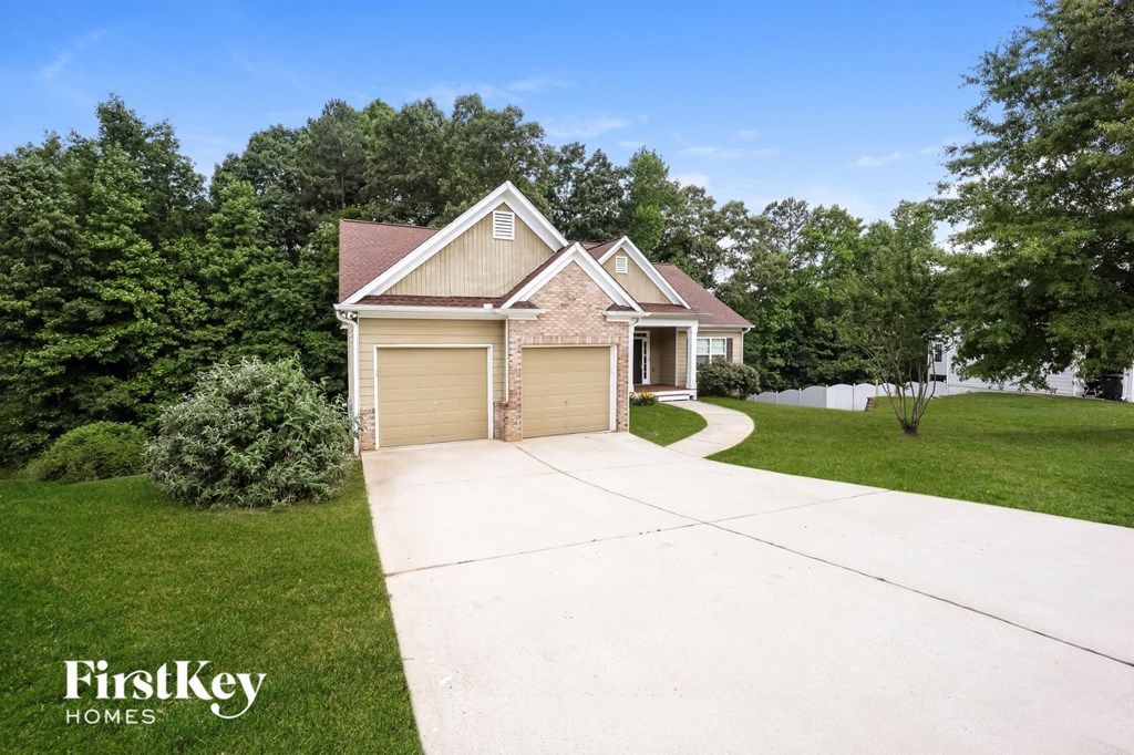 A house with a driveway in front of it.