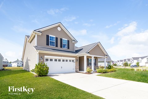 a house with a driveway and a garage door