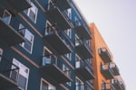a tall building with balconies on the side of it