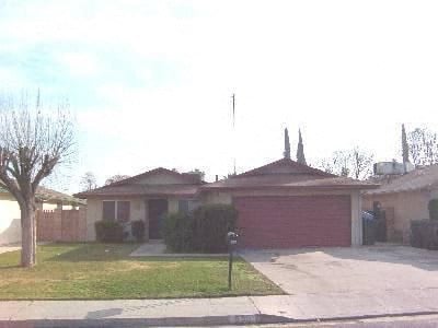 a house with a red garage door