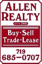 A red and white sign for Allen Realty.