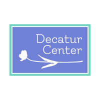A blue sign with the words Decatur Center and a flower.