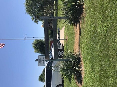 an aerial view of a street with a traffic light and palm trees