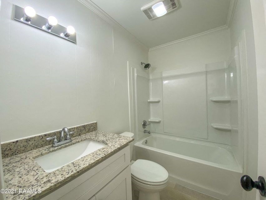 a bathroom with a sink toilet and a shower