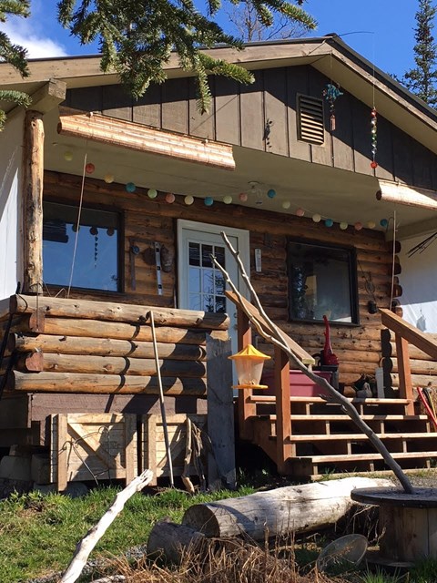 a cabin with wooden steps and a porch