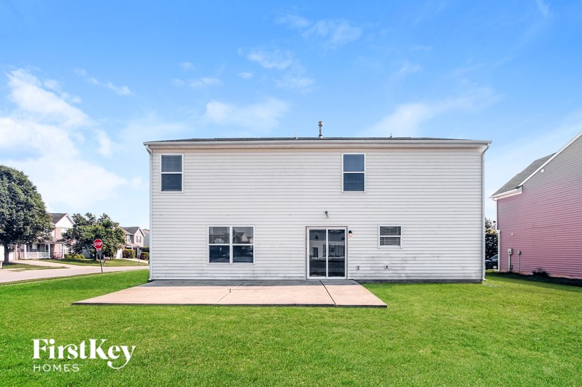 A white building with a sign that says FirstKey Homes.
