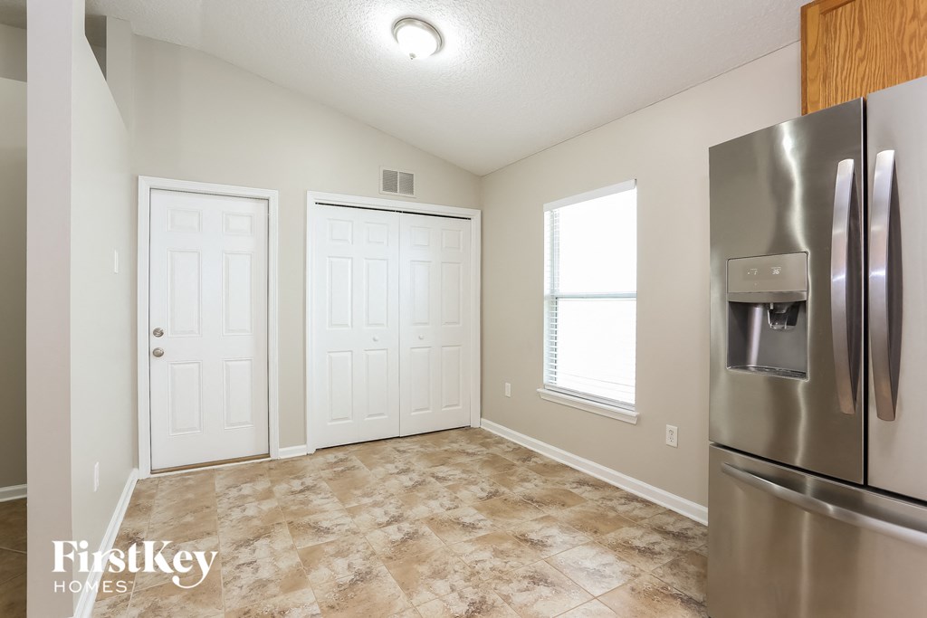 the kitchen is clean and ready to use with stainless steel appliances