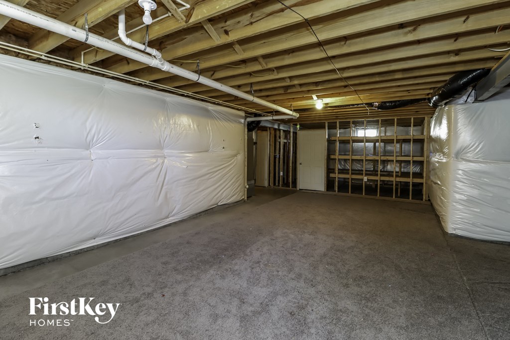 a large garage with a bunch of white insulation in it