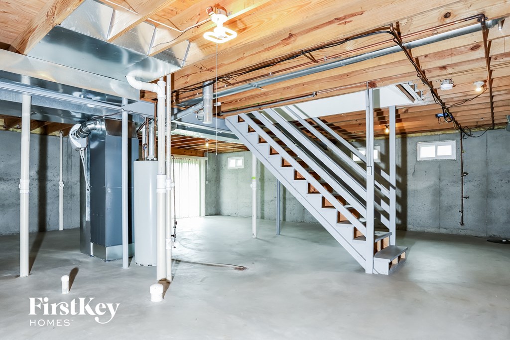 a basement with a staircase in the middle of it