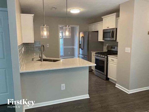 a kitchen with a counter top and a sink