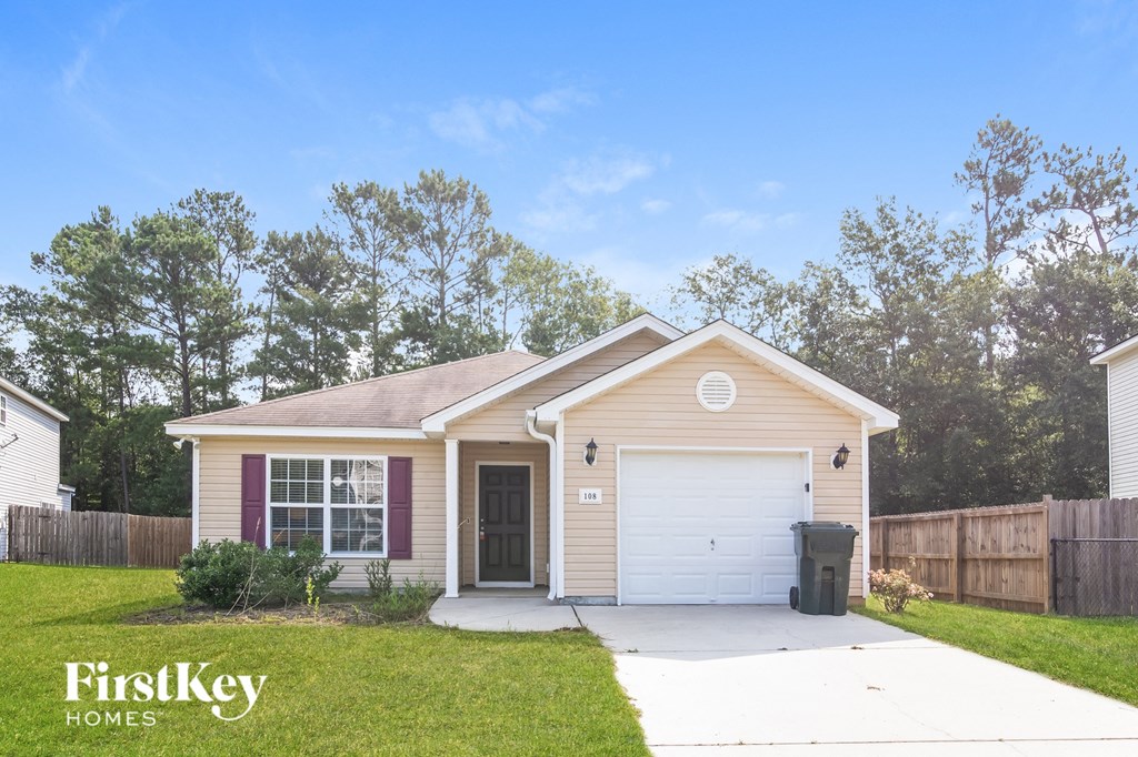 A house with a garage and a driveway is for sale.
