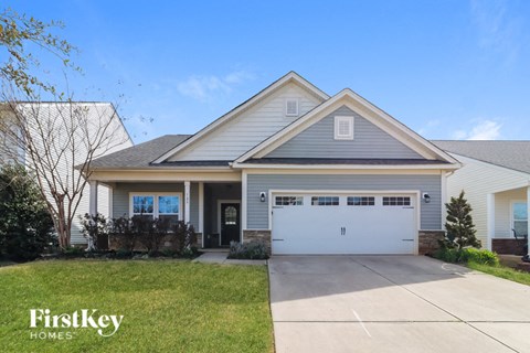 A house with a garage is for sale by FirstKey Homes.