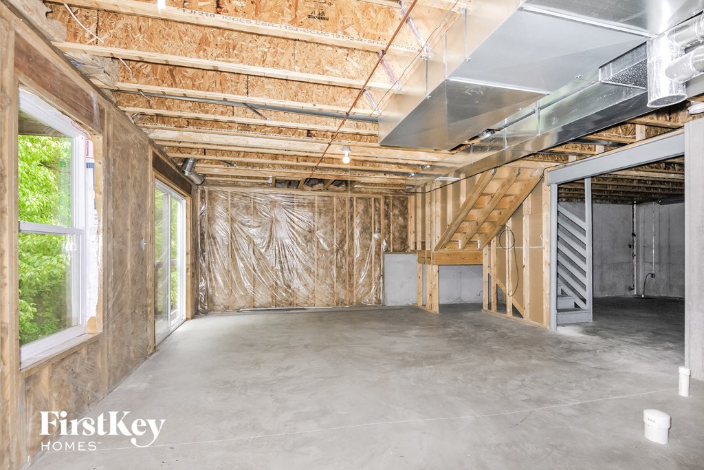 a living room with insulation on the walls and a large window