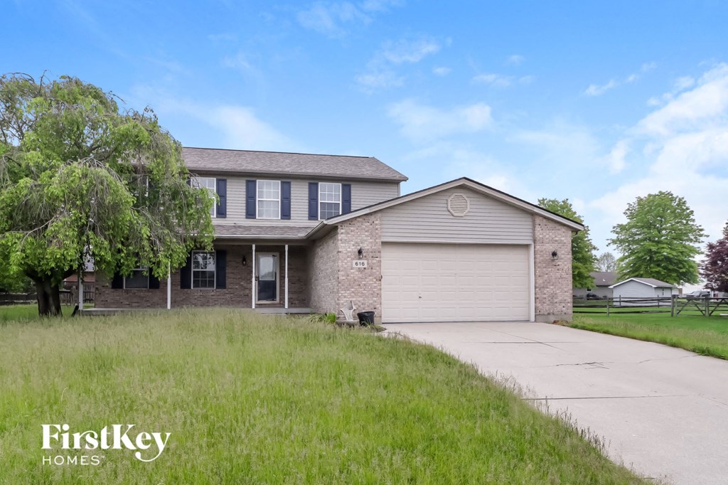 A house with a garage is for sale by FirstKey Homes.