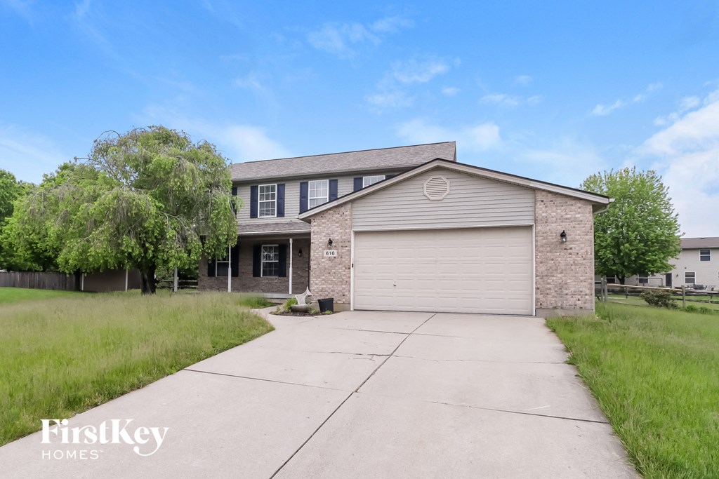 A house with a garage is for sale by FirstKey Homes.