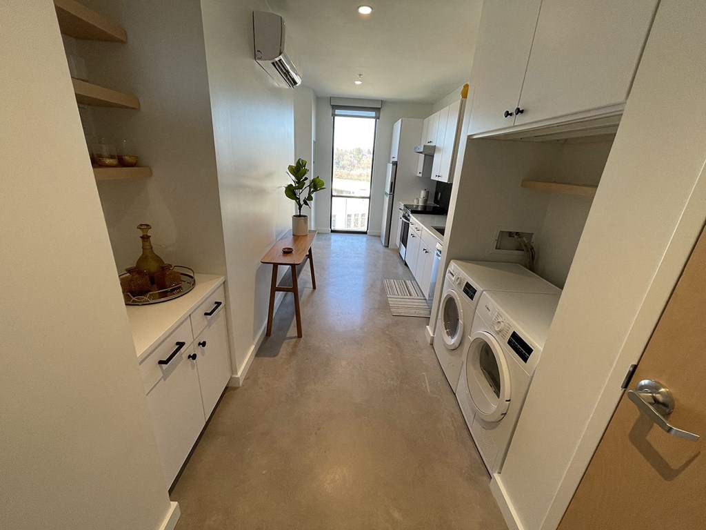 a laundry room with a washing machine and a dryer in it