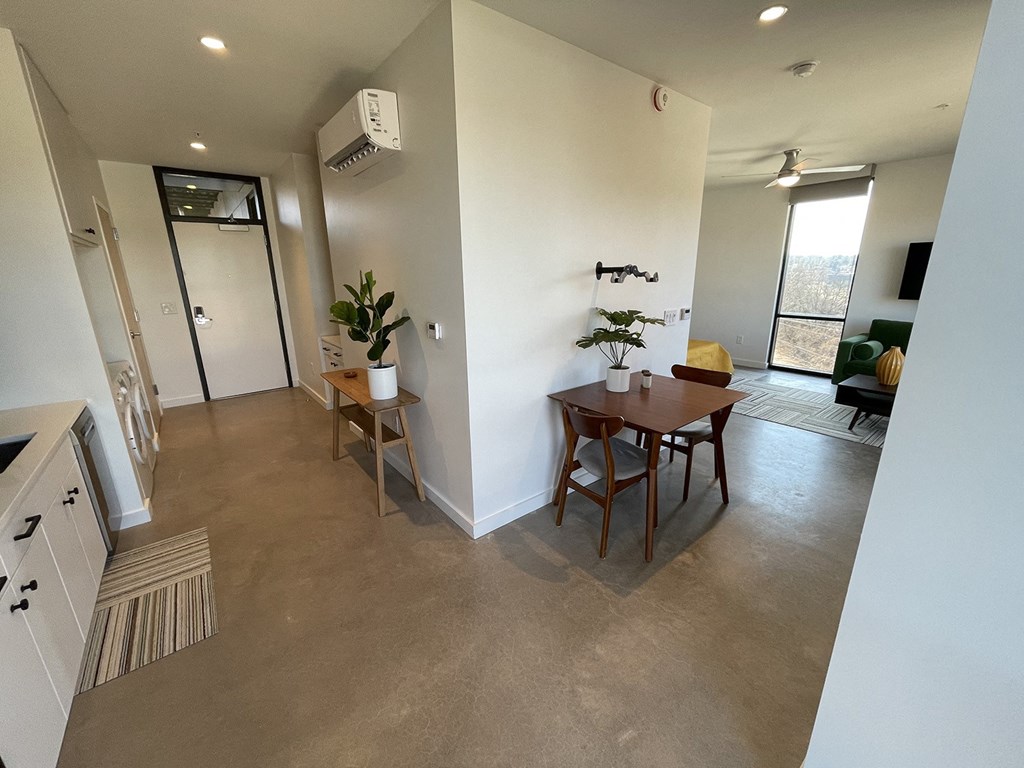 a view of a living room and dining room from the kitchen