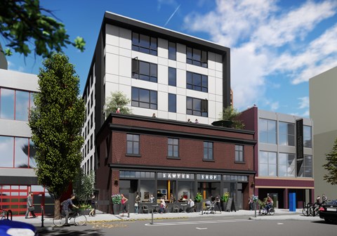 A modern building with a red brick storefront is depicted in the image.