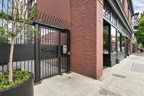 A black gate with the word "Schwabe" written on it.