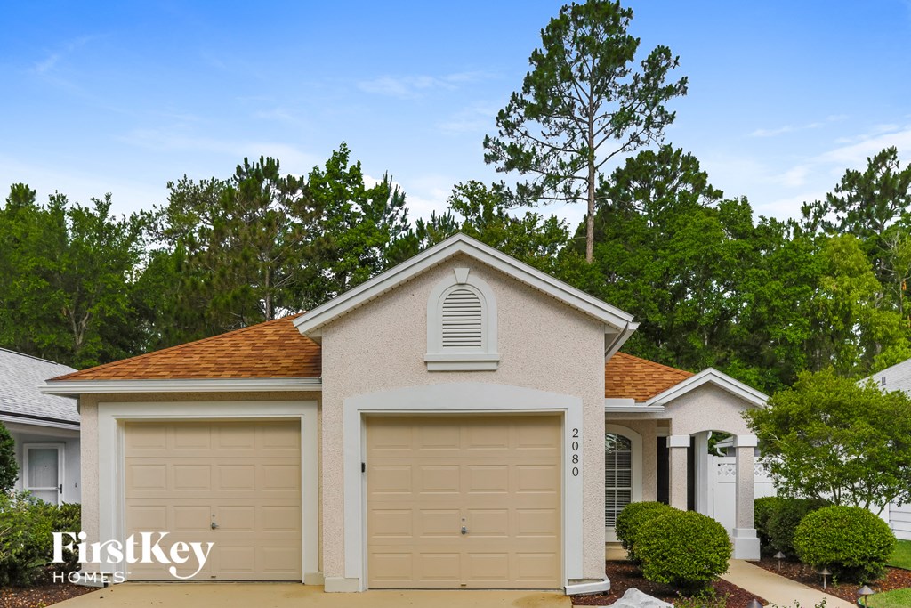 A two-car garage with the number 2018 on the door is part of a residential property.