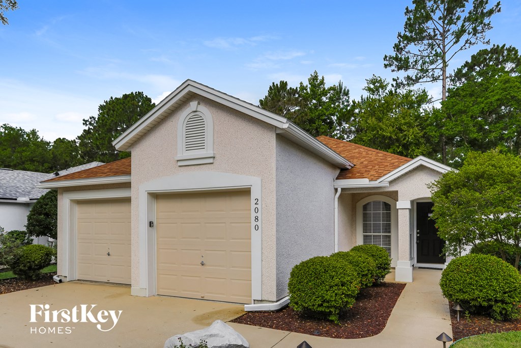A house with a garage door that says 2018.