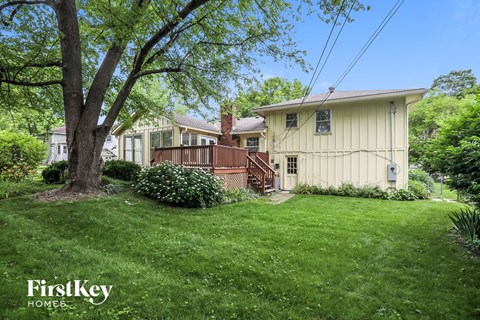 a house with a yard and a deck