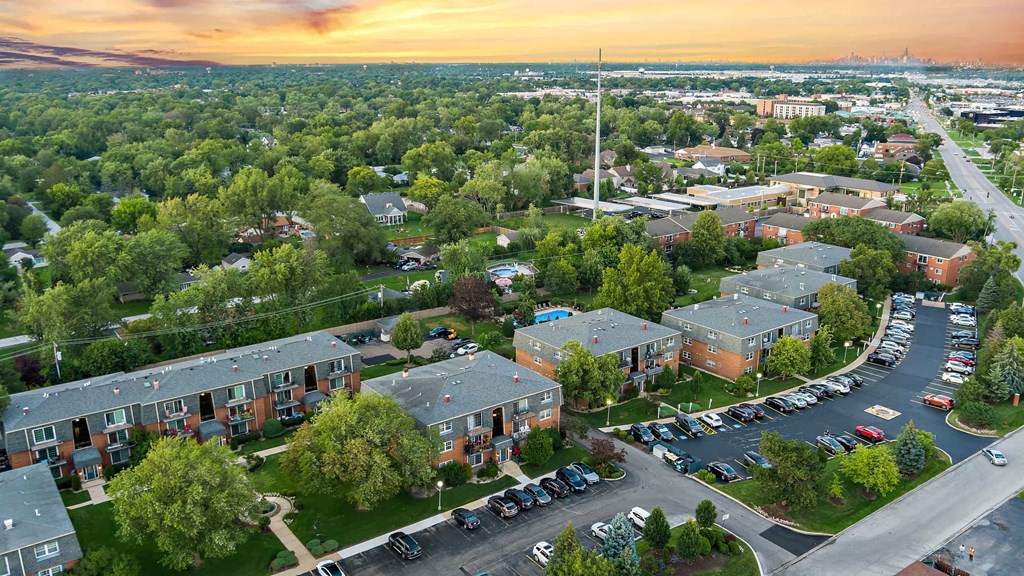 an aerial view of a neighborhood with houses and cars parked