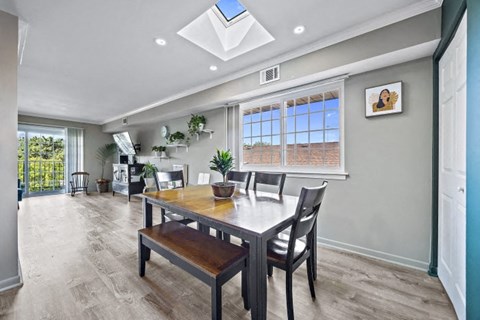 a dining room with a table and chairs