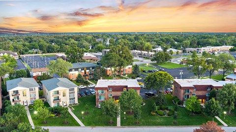 an aerial view of a city with houses and trees