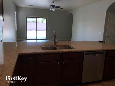 A kitchen with a sink and a dishwasher.
