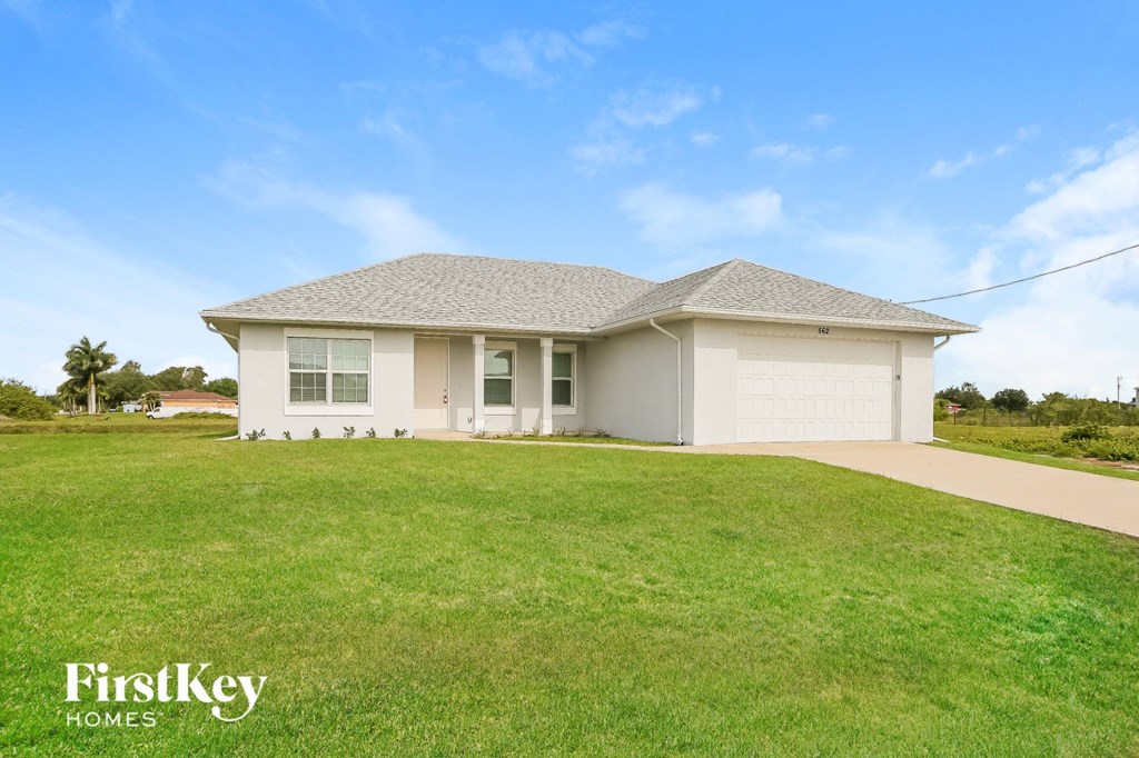 a house with a lawn in front of it