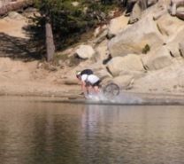 a person on a bike in the water