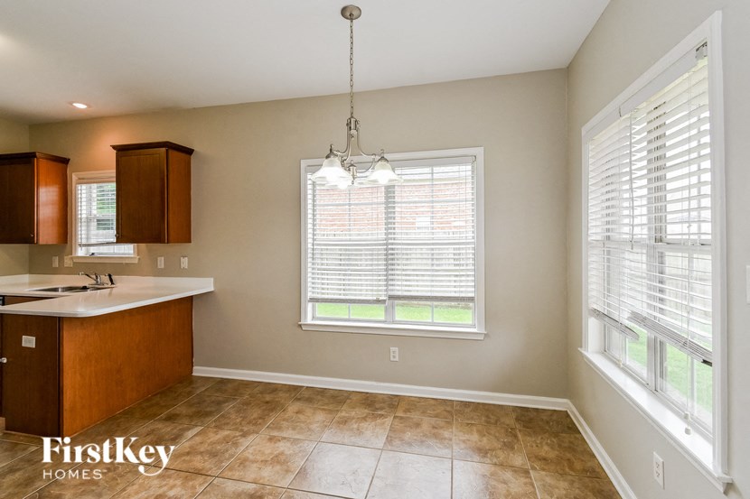 a kitchen with a sink and a large window