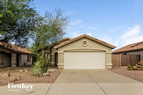 a house with a driveway and a garage door