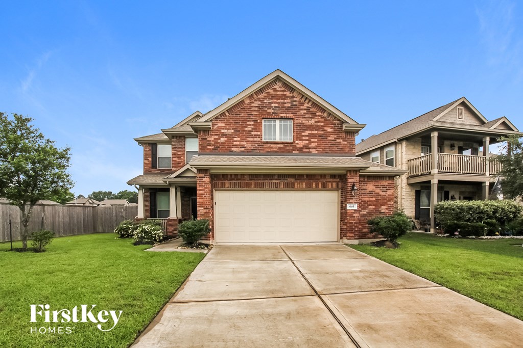 a brick house with a white garage door