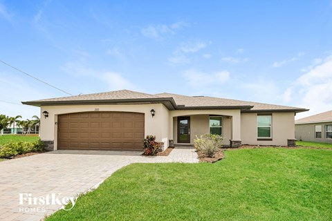 a house with a driveway and a garage door