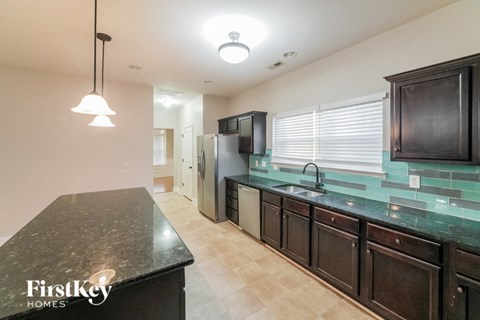 a kitchen with a counter top and a sink
