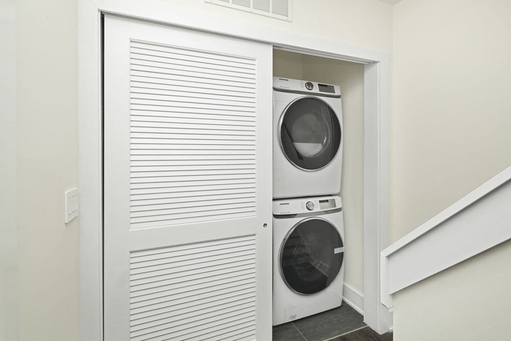 a laundry room with a washer and dryer in a closet