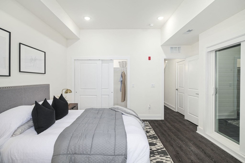 a bedroom with a bed and a closet