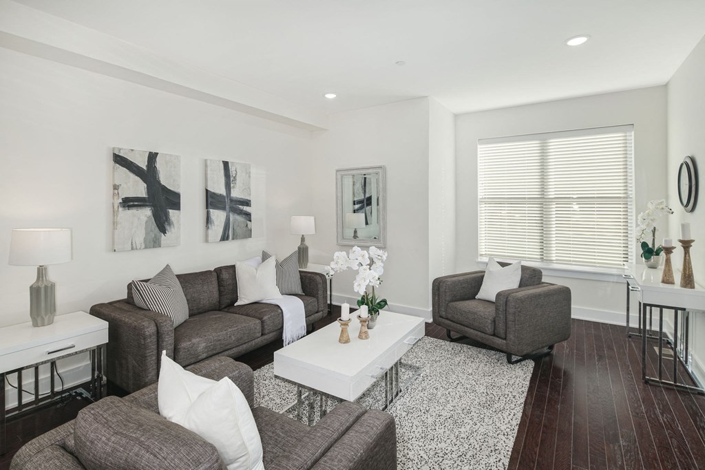 a living room with couches and chairs and a coffee table