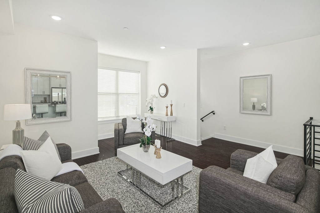 a living room with couches and a coffee table
