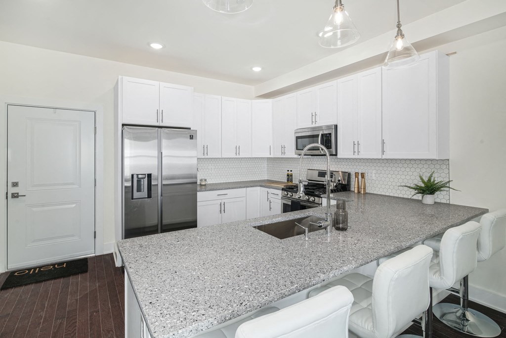 a kitchen with a counter top and a sink