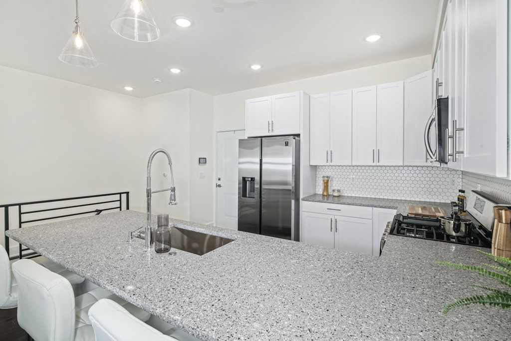 a kitchen with a counter top and a sink