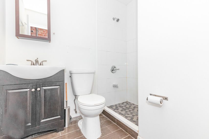 a bathroom with a toilet and a sink