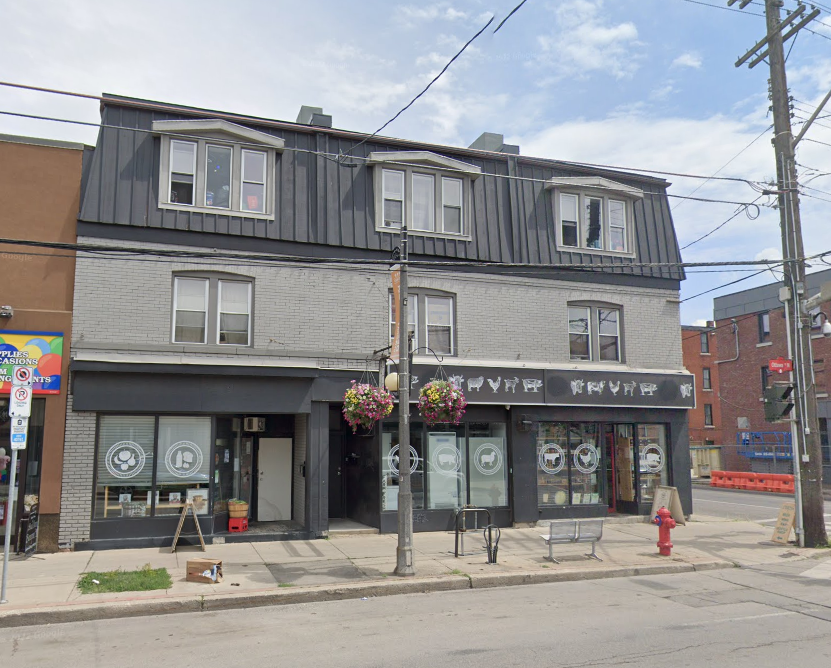 an old building on the corner of a city street
