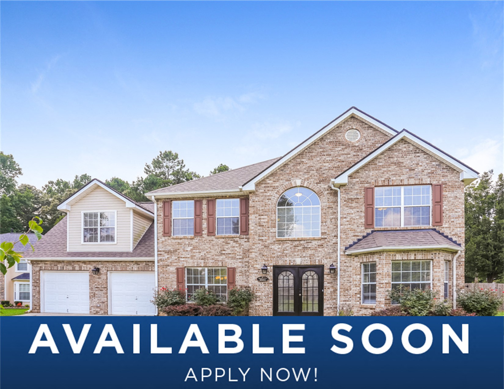a large brick house with aqualite soon on a blue sky
