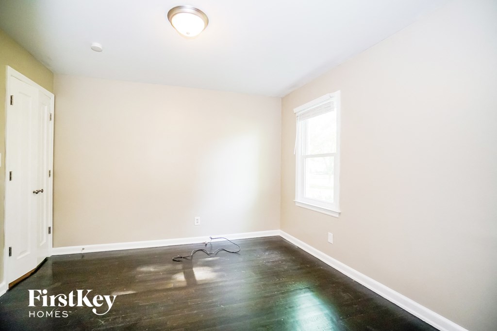 a empty room with white walls and a window
