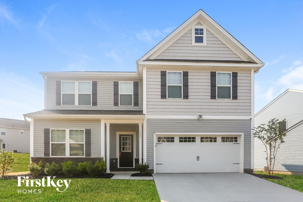 a white house with a white garage door