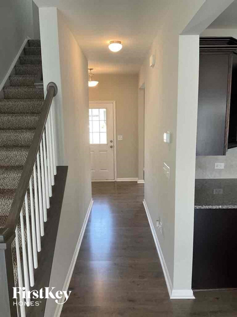 a view of the hallway of a house from the stairs