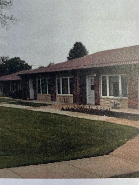 a house with a lawn in front of it